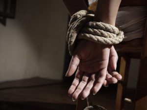 Hands tied with rope