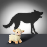 Sheep with wolf shadow