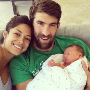 Michael Phelps, Nicole Johnson and baby Boomer.